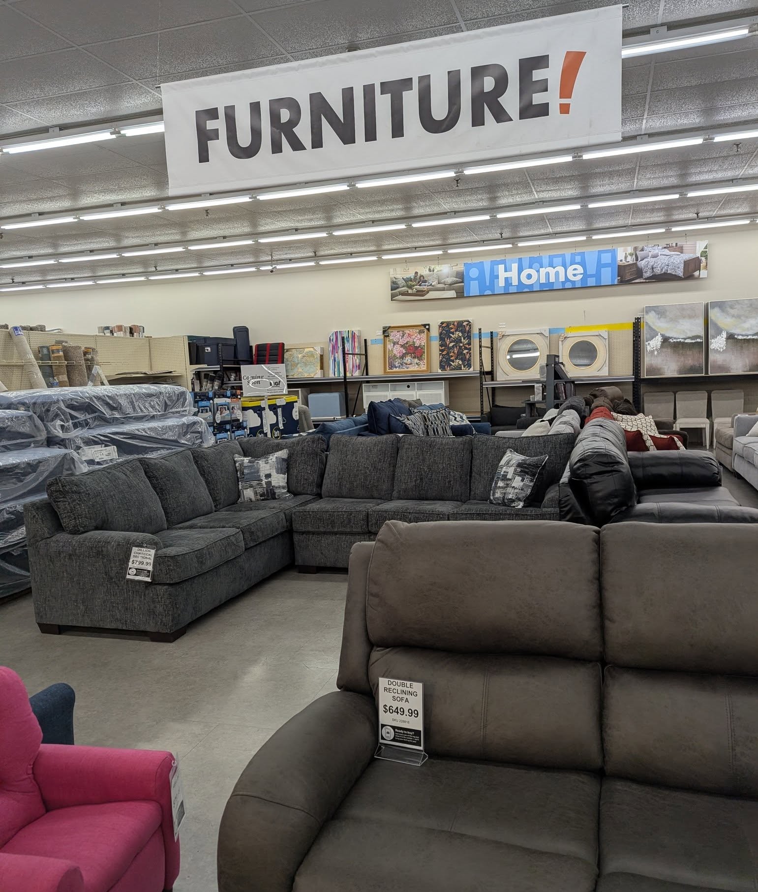 Printed QR stands deployed on desks and tables in a modern showroom, branded for in-venue scanning.